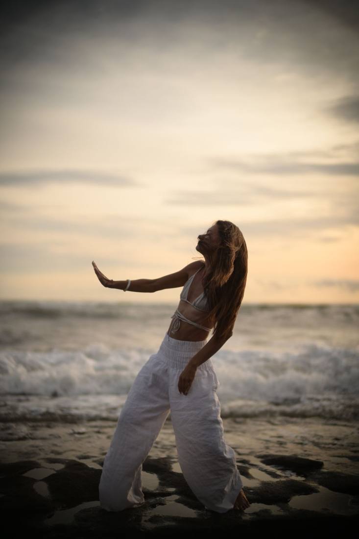 Pip dancing on the beach at sunset